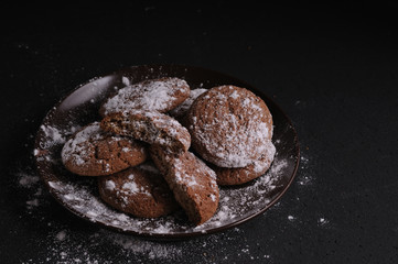 oatmeal cookies on a black table in castor sugar