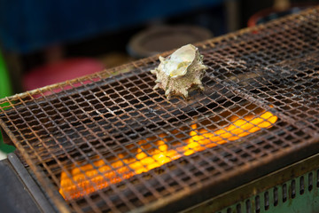 Japanese shellfish grill in fresh market street.