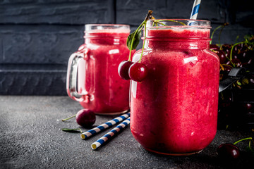 Summer fruity vitamin drink. homemade cherry smoothie on dark background
