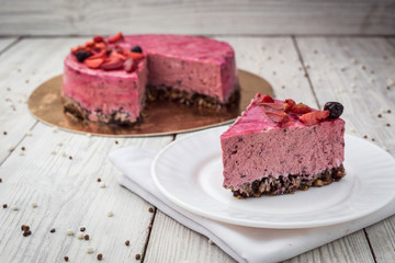 Strawberry Cake dessert with vanilla cream on wooden background