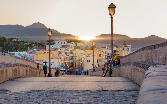 Fototapeta Sunset view Ischia street with colourful houses, Italy