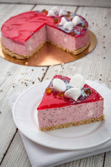 Strawberry Cake dessert with candies on wooden background