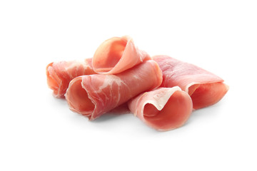 Tasty prosciutto slices on white background