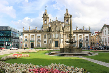 Fototapeta premium Church of Saint Mark the Evangelist with grass and flowers in foreground. Braga, Portugal.