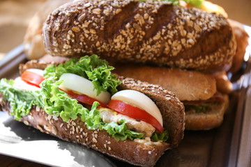 Tasty sandwiches on tray