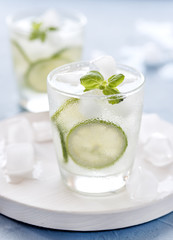 Healthy Lemonade Lime with Fresh Mint and Ice in a Glass on Blue Background Tasty Homemade Detox Water Infused Water Vertical
