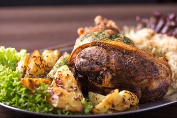 Roast pork knuckle with garnish