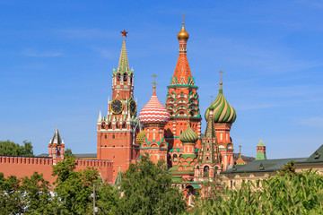 Fototapeta na wymiar St. Basil's Cathedral and towers of Moscow Kremlin on a sunny summer morning