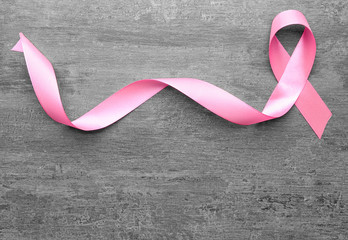 Pink ribbon on grey background. Breast cancer concept