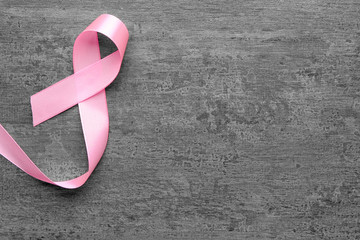 Pink ribbon on grey background. Breast cancer concept