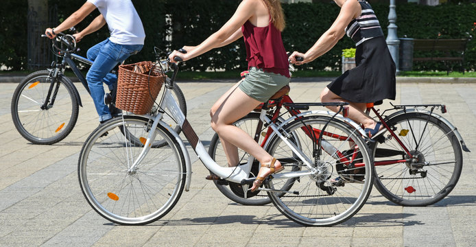 People with bicycles in the city