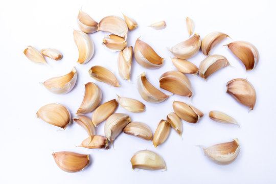 Garlic cloves ( Allium sativum ) peeled  isolated on white background, Pattern concept