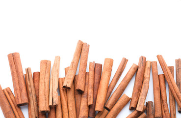Aromatic cinnamon sticks on white background