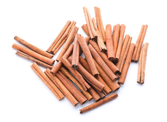 Aromatic cinnamon sticks on white background