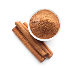 Aromatic cinnamon sticks and powder on white background