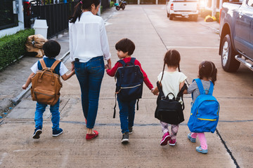 Family children kid son girl and boy kindergarten walking going to school