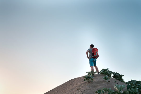 traveler with orange backpack © Kiryl Lis