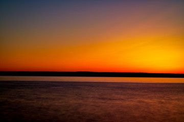 Colourful sky after sun sets in back country lake