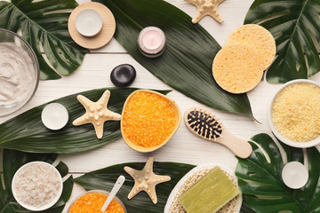 Spa background with facial mask and cream on white wood