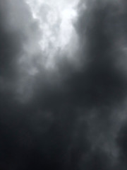 Obraz na płótnie Canvas dark dense gloomy dramatic thundercloud