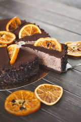 Chocolate cake with cream and profiterole