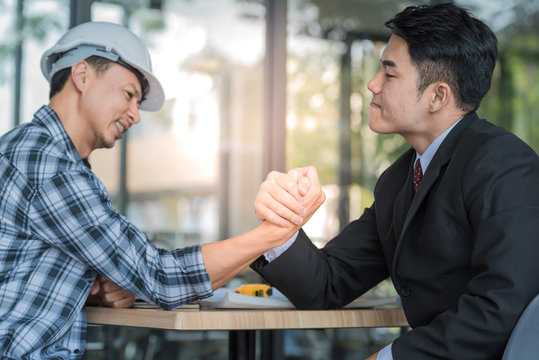 Young Business Man Arm Wrestle Together, Competition Concepts.