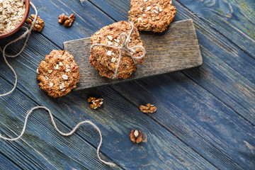Composition with delicious oatmeal cookies on wooden background