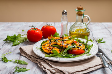 Delicious grilled pumpkin and arugula  salad 
