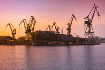 shipyard with large ship under construction