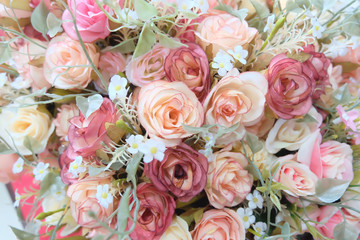 romantic pastel rose wedding bouquet with red background , retro filter