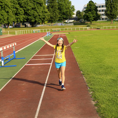 Obraz premium Little girl have fun on the stadium