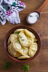 Dumplings, filled with cottage cheese (farmer cheese). Varenyky, vareniki, pierogi, pyrohy. View from above, top studio shot