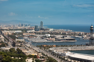 Yachts and sailboats moored in the Port Vell of Barcelona
