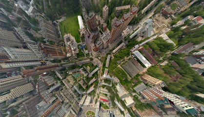View from the air on old and new russian buildings in green area in the city with a lot of cars and...