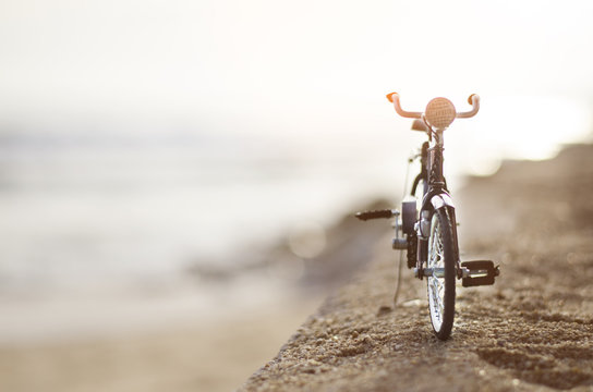 bicycle toy on beach sunset time holiday