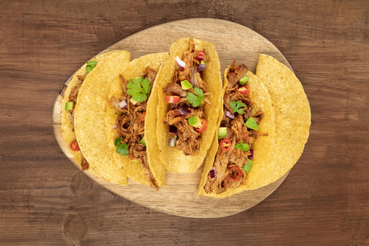 Overhead Photo Of Mexican Tacos With Pulled Pork, Avocado, Chili Peppers, Cilantro, With Place For Text