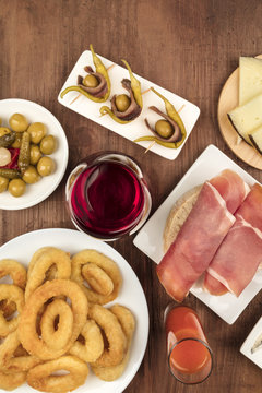 Spanish food. Overhead photo of different tapas with wine, with copy space
