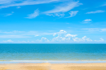 Fototapeta na wymiar Tropical beach in morning with blue sky and cloud at Huahin, Thailand, Wat Khao Takiap