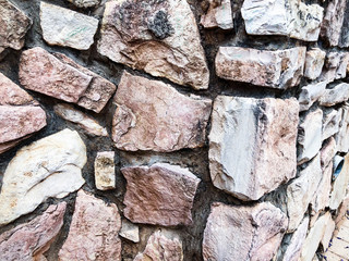 Close up of natural stone wall. Stone wall texture 
