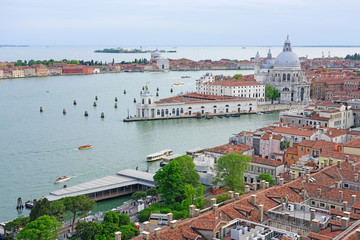 Fototapeta na wymiar Panoramic view of the Dogana, the Grand Canal and red tiled roofs in Venice from the Campanile on Piazza San Marco (Saint Mark Square).