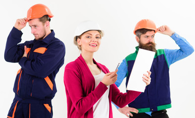 Team of architects, builders with woman manager,
