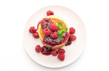 pancake with fresh raspberries and raspberry sauce