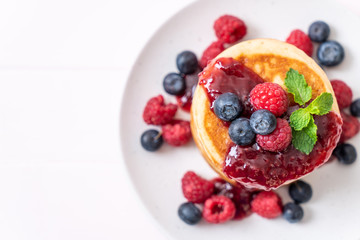 pancake with fresh raspberries and blueberries