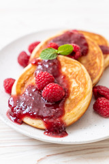 pancake with fresh raspberries and raspberry sauce