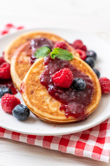 pancake with fresh raspberries and blueberries