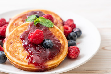 pancake with fresh raspberries and blueberries
