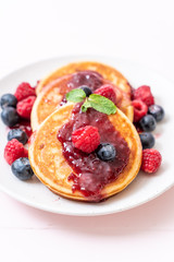 pancake with fresh raspberries and blueberries