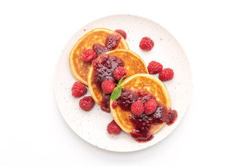 pancake with fresh raspberries and raspberry sauce