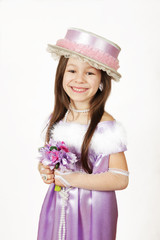 little girl in purple dress and hat