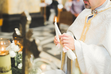 Married couple posing in a church after ceremony